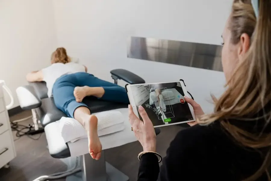 Clinician taking a 3D scan of a patient's foot on a tablet